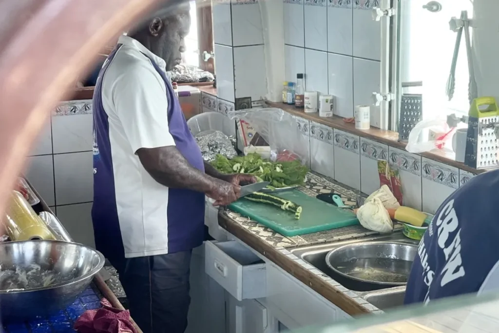 Chef prepares lunch on Whales Tale Cruise.